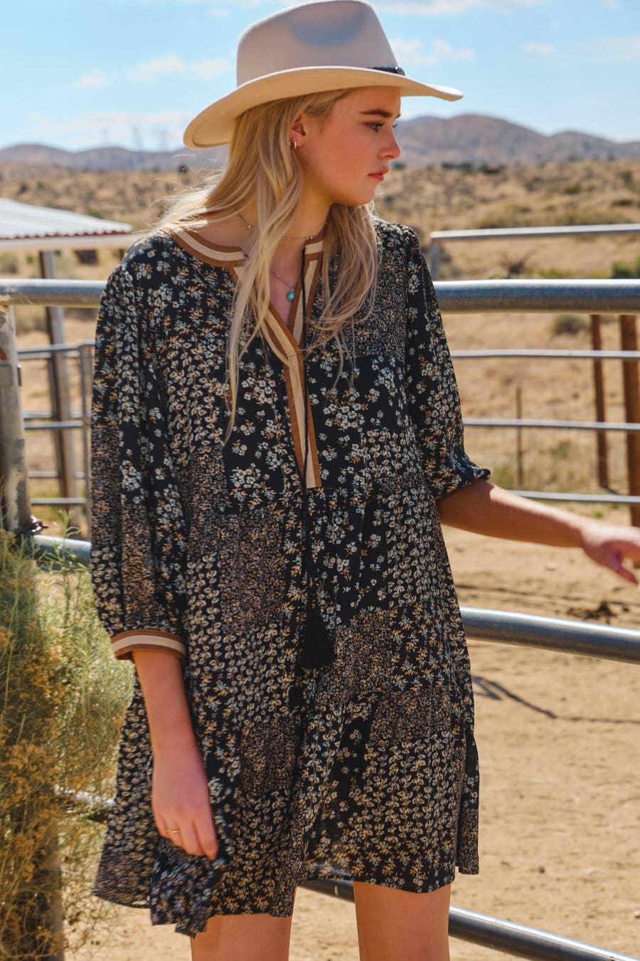 Lightweight boho dress styled with boots in a Western-inspired look.