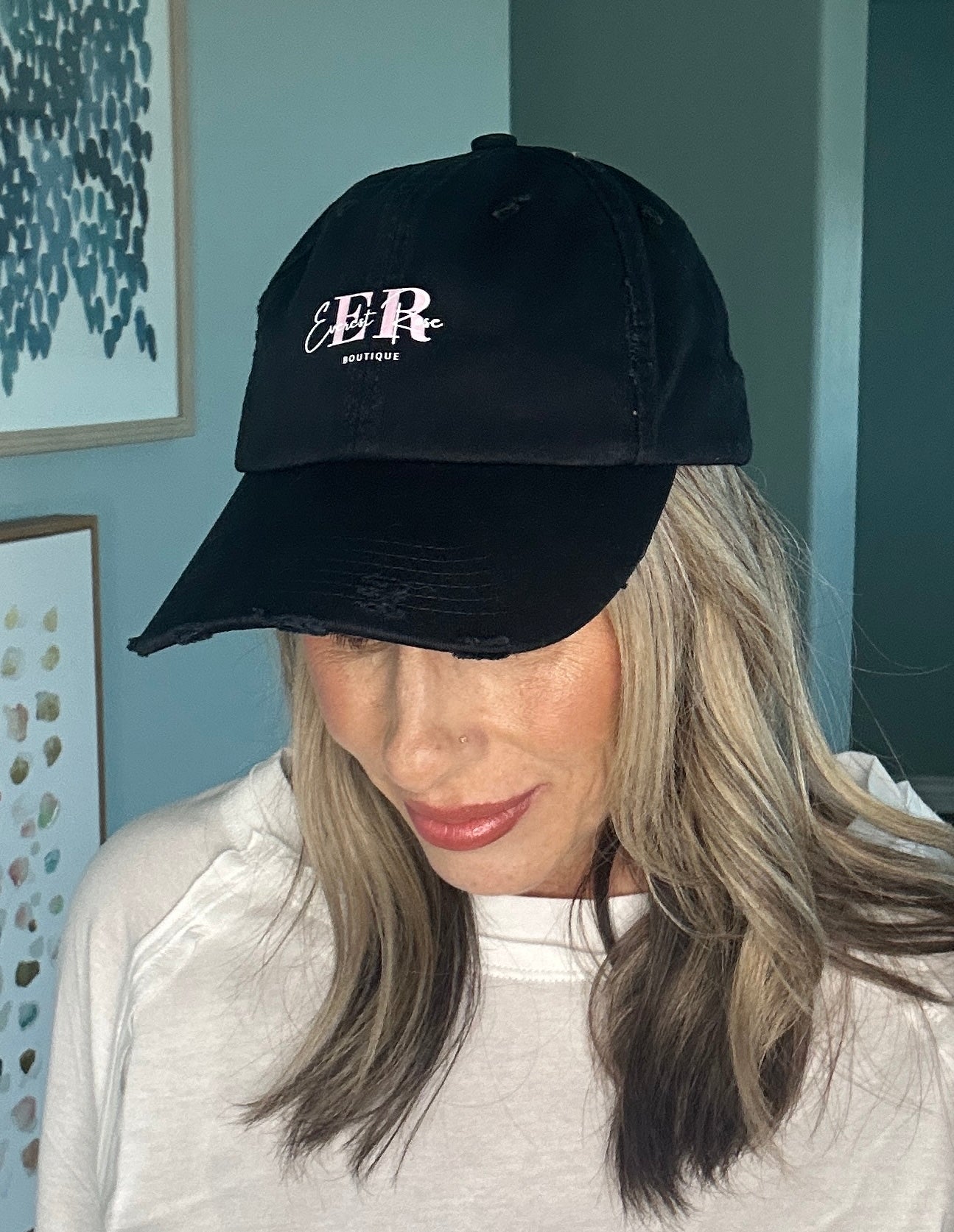 Casual black logo cap styled as everyday boutique accessory.