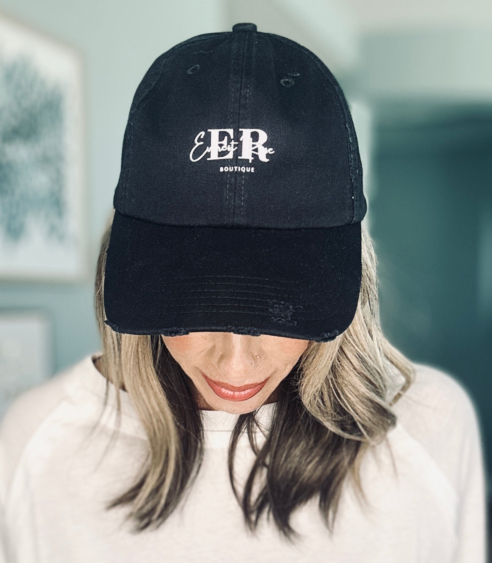 Classic black cotton hat featuring white Everest Rose Boutique logo.